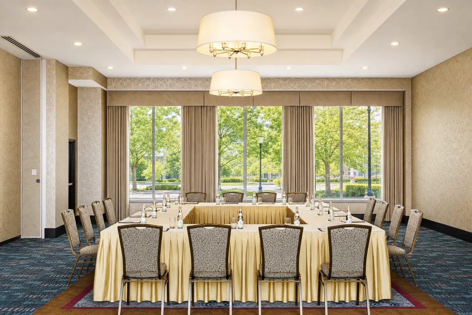 Meeting room at Pinnacle Hotel at the Pier set in a U shape with natural light and views of the trees outside